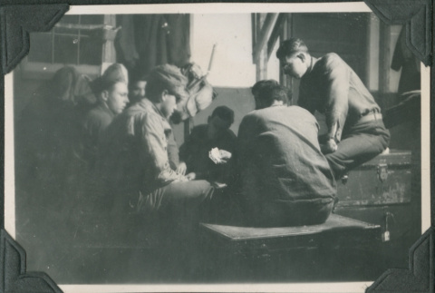 Men sitting around table playing cards (ddr-ajah-2-376)