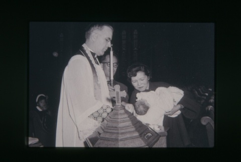 (Slide) - Image of priest baptizing a child (ddr-densho-330-226-master-6eacd8516f)