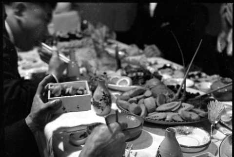 Table with various food and drink (ddr-densho-426-1694)
