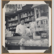 Man behind shop counter (ddr-densho-542-92)
