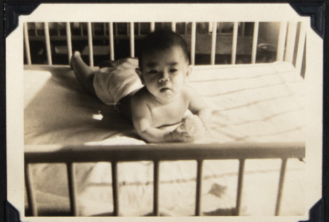 Baby playing in a crib (ddr-densho-542-650)