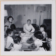 Group playing Monopoly (ddr-densho-522-549)