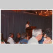 Man speaking at podium (ddr-densho-368-383)