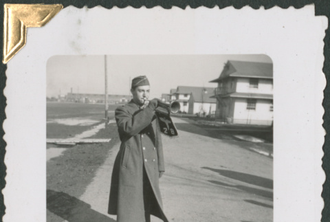 Man with bugle with insignia for Medical Training Battalion 28 (ddr-densho-434-57)