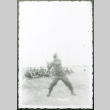 Soldier hitting baseball (ddr-densho-1007-761)