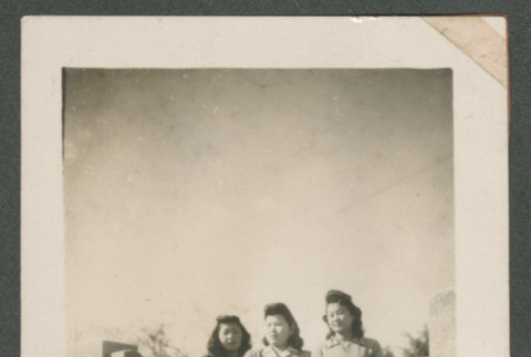 Three women and a child along a bridge (ddr-densho-550-280)