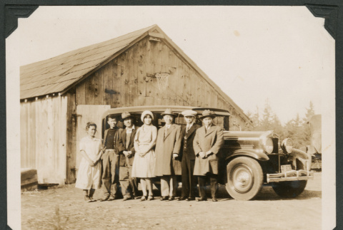 Group photo of seven people with a truck (ddr-densho-483-164)