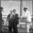 Three men and crew member on board ship (ddr-densho-426-265)