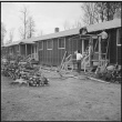 Japanese Americans building a barrack porch (ddr-densho-37-407)