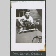 Man playing guitar (ddr-densho-434-43)