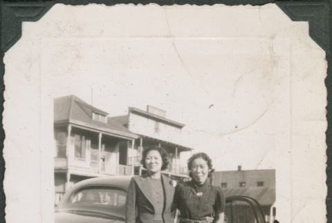 Two women next to car (ddr-densho-316-357)