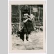 Young girl with dog toy (ddr-densho-475-352)