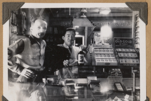 Gary Kikawa inside The Owl Drug Co. (ddr-densho-542-60)