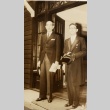 Two men standing in a doorway (ddr-njpa-1-2498)