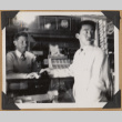 Two men at The Owl Drug Co. (ddr-densho-542-162)