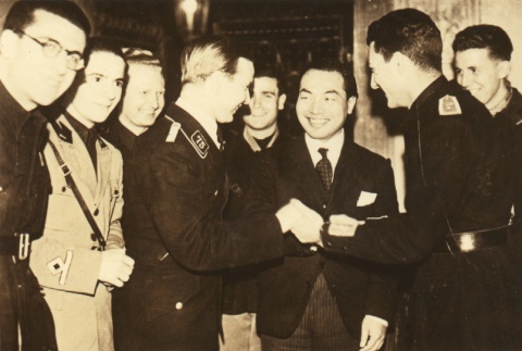 Japanese professor greeting German and Italian students (ddr-njpa-4-1481)