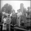 Group standing by stones in cemetery (ddr-densho-426-2473)