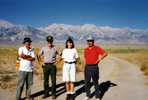 [One woman and three men at Manzanar] (ddr-csujad-29-323)
