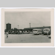 People loading into trucks and buses (ddr-densho-475-390)