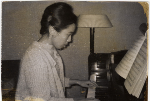 Diana playing piano (ddr-densho-409-57)