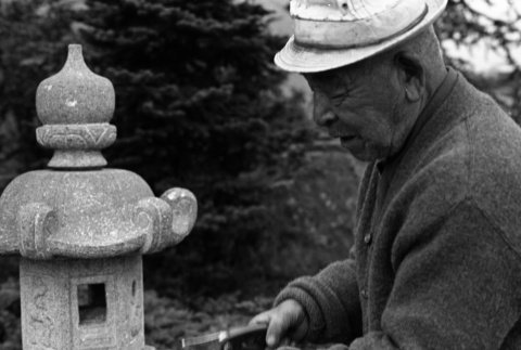 Fujitaro Kubota with stone lantern, Seattle University (ddr-densho-354-2073)