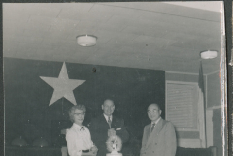 Agnes and Chester Sakura with another man standing by cake (ddr-densho-523-279)