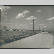 Photo of camp building and road (ddr-densho-493-104)