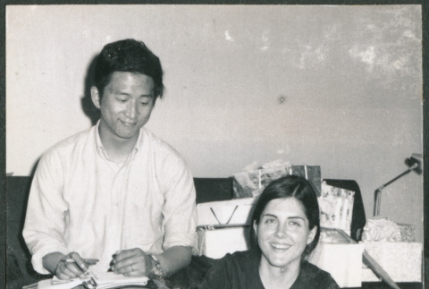 Couple unwrapping gifts (ddr-densho-523-526)
