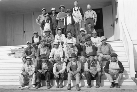 Construction workers seated on stairs (ddr-fom-1-400)