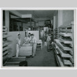 Men loading drying racks (ddr-densho-499-57)