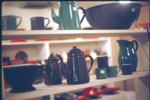 Display of enamelware coffee pots and cups (ddr-densho-426-318)