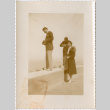 Three people by low wall (ddr-densho-426-1959)