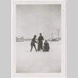 Three people playing in the snow (ddr-manz-7-76)