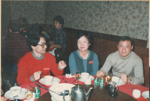 Three people sitting at a table (ddr-densho-426-2219)