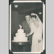 Bride and groom cut their wedding cake (ddr-densho-397-30)