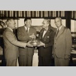Four men exchanging a bowl (ddr-njpa-1-495)