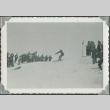 Crowd watching a skier clear a rise (ddr-densho-321-433)