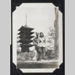 Couple poses in front of a pagoda (ddr-densho-404-198)