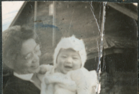 Woman holding baby (ddr-densho-523-98)