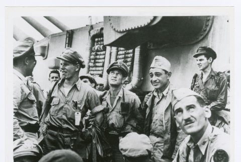 Max Desfor and other correspondents after Japanese surrender (ddr-densho-1007-96)