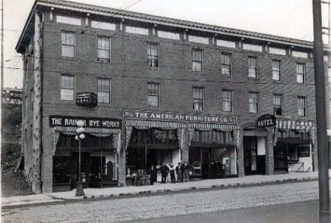 Two views of building with The Rainier Dye Works, American Furniture Company and Jackson Hotel (ddr-densho-474-185)