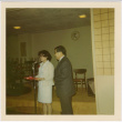 Tomoye and Henri Takahashi standing at microphone (ddr-densho-426-164)