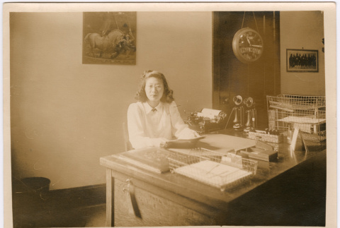 Yoriko (Shimasaki) Kitagawa sitting at desk (ddr-densho-539-11)