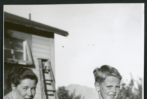 Photograph of Elizabeth Moxley and a young boy at Manzanar (ddr-csujad-47-284)
