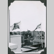 Two flags and view of city (ddr-ajah-2-617)