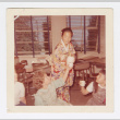 Elaine Komai pouring tea (ddr-densho-562-69)