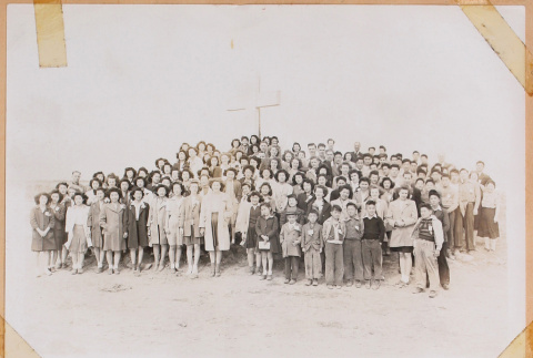Large group photo in front of a cross (ddr-densho-483-439)
