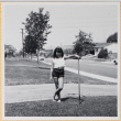 Girl standing in yard (ddr-densho-522-104)