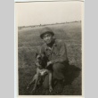 Soldier and dog in a field (ddr-densho-201-192)