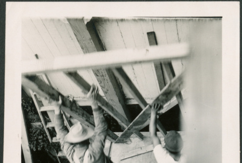 Men lifting wall framing (ddr-densho-426-2249)